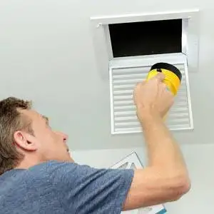 Pro Aire technician cleaning HVAC ducts in a Warrenton, MO home